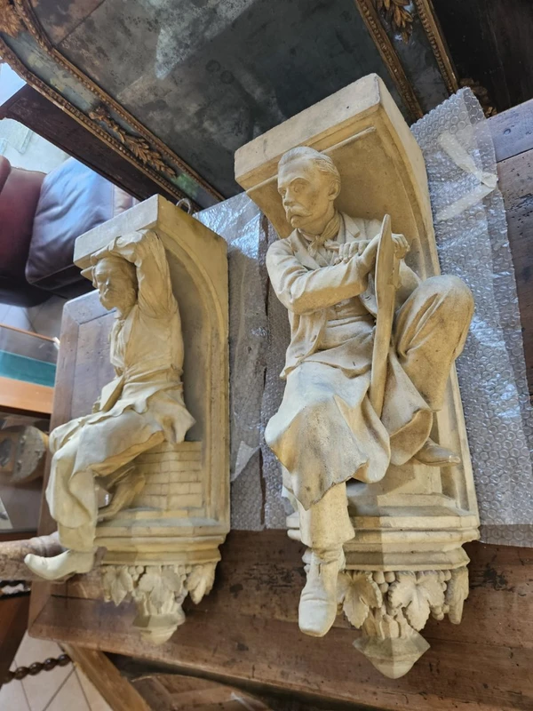 Coppia di elementi scultorei in terracotta – Firmati e datati 1866 “W. Wolff”