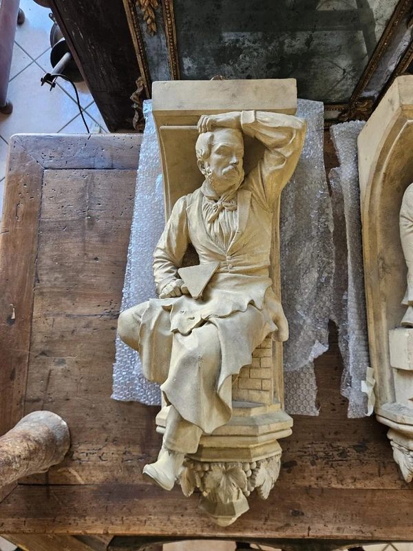 Coppia di elementi scultorei in terracotta – Firmati e datati 1866 “W. Wolff”