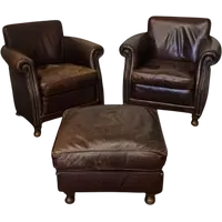 Paire de fauteuils en cuir avec pouf - 20e siècle