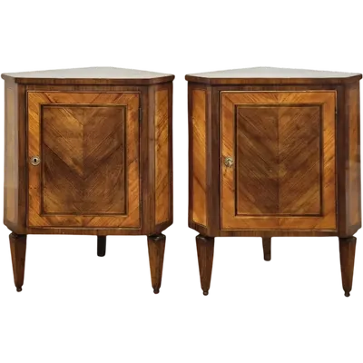 Pair of Louis XVI style panelled cornerboards, early 19th century
