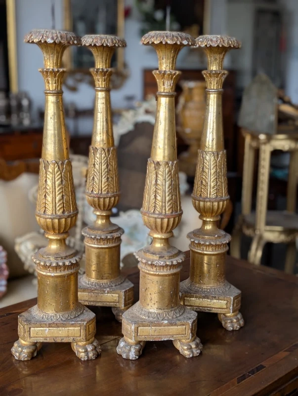 Four Louis XVI gilded wooden mecha candlesticks, late 18th century