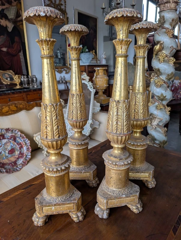 Four Louis XVI gilded wooden mecha candlesticks, late 18th century