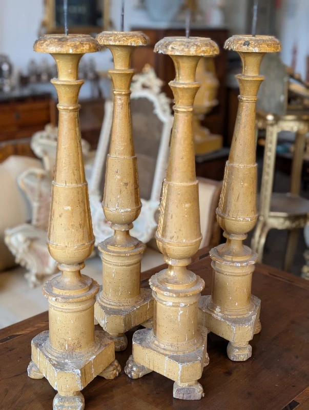Four Louis XVI gilded wooden mecha candlesticks, late 18th century