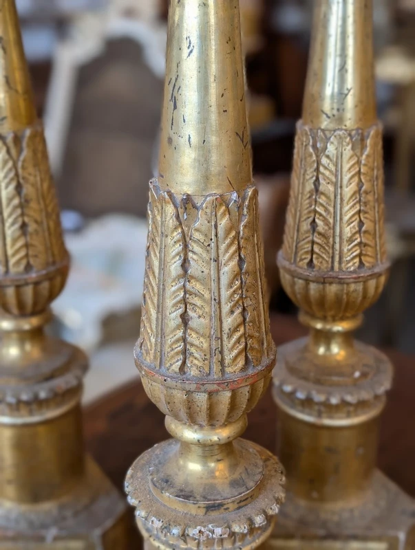 Four Louis XVI gilded wooden mecha candlesticks, late 18th century