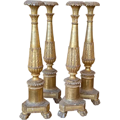 Four Louis XVI gilded wooden mecha candlesticks, late 18th century