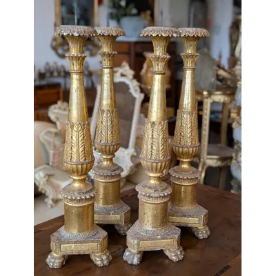 Four Louis XVI gilded wooden mecha candlesticks, late 18th century