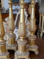 Four Louis XVI gilded wooden mecha candlesticks, late 18th century