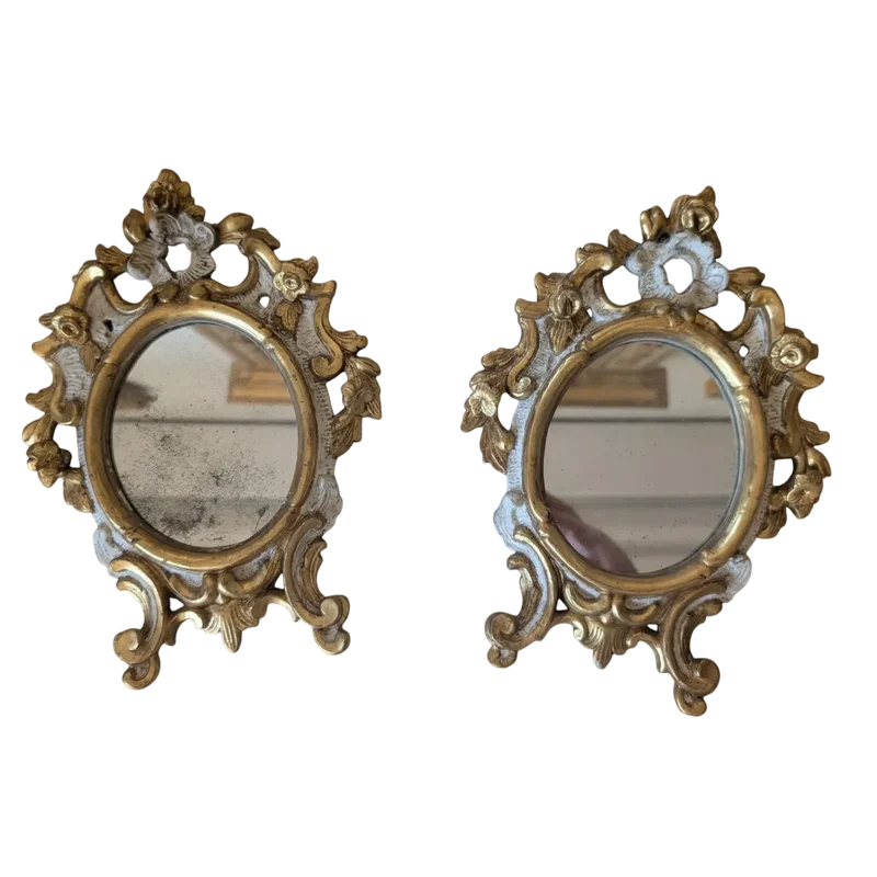 Pair of carved and gilded wooden wall mirrors