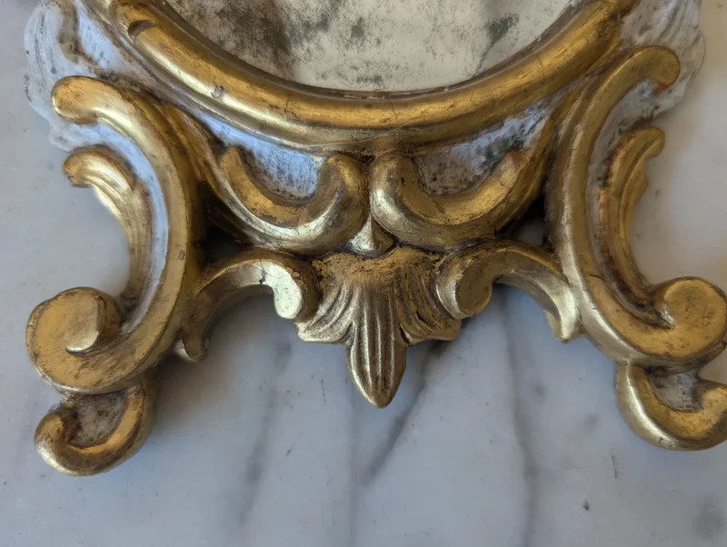 Pair of carved and gilded wooden wall mirrors