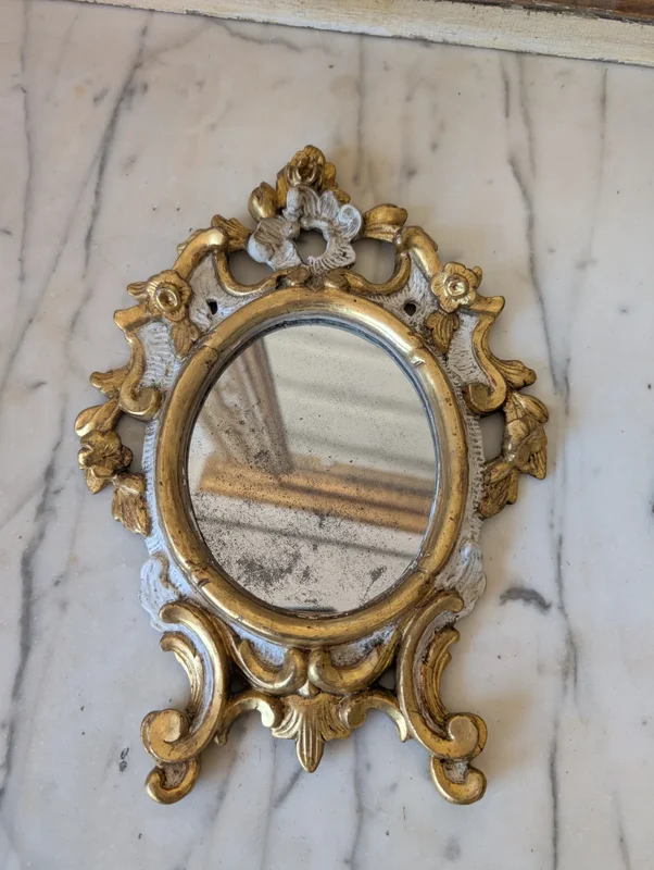 Pair of carved and gilded wooden wall mirrors