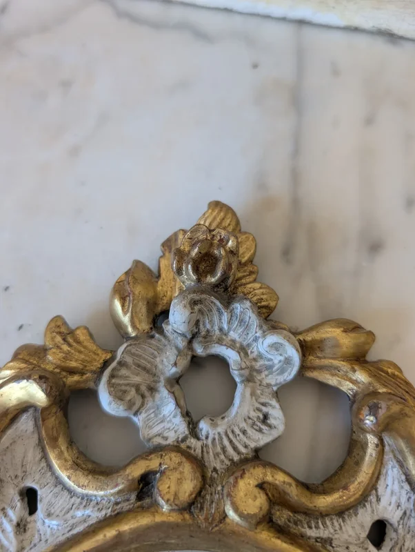 Pair of carved and gilded wooden wall mirrors