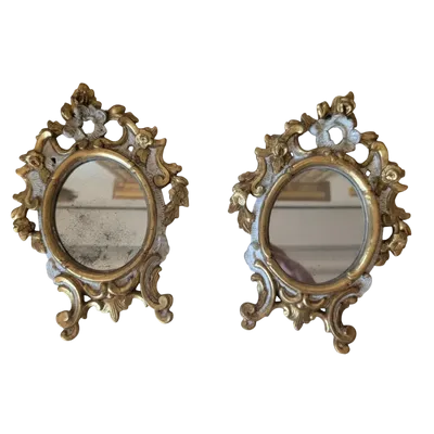 Pair of carved and gilded wooden wall mirrors