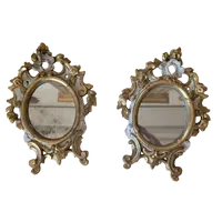 Pair of carved and gilded wooden wall mirrors