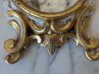 Pair of carved and gilded wooden wall mirrors