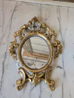 Pair of carved and gilded wooden wall mirrors