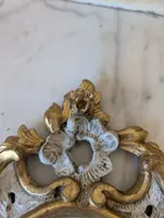 Pair of carved and gilded wooden wall mirrors