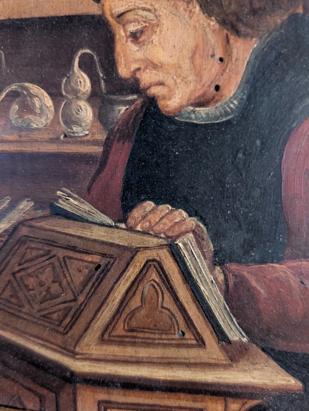 Panel painting depicting scholar in library, in gilt frame