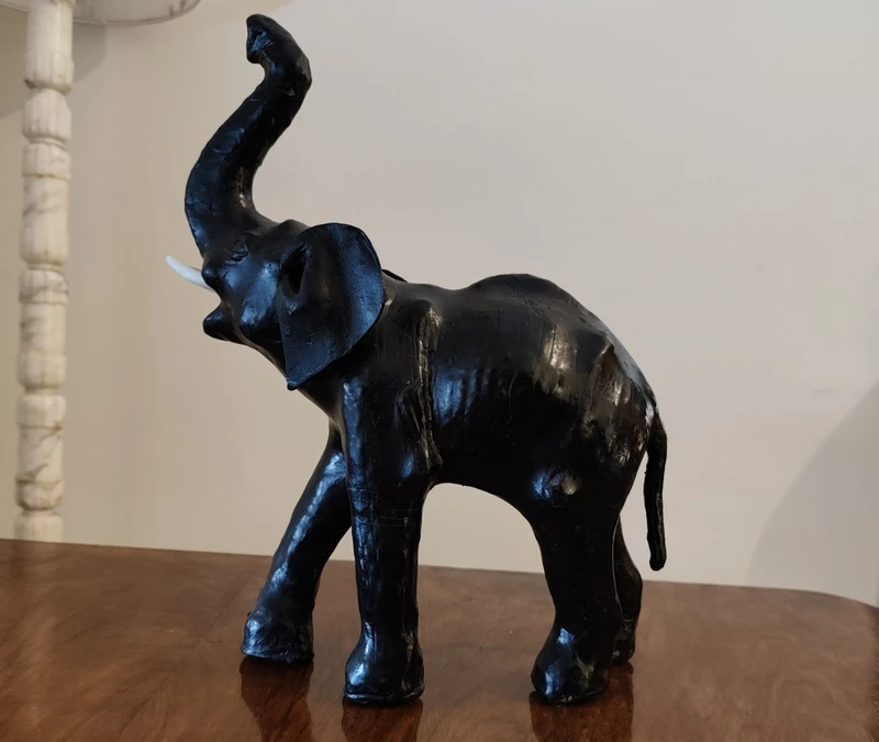 Elephant with tall trunk from the 1800s Papier machè