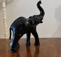Elephant with tall trunk from the 1800s Papier machè
