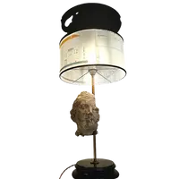 Lampada con testa in gesso e nerofumo, paralume con lucidi di architettura 900