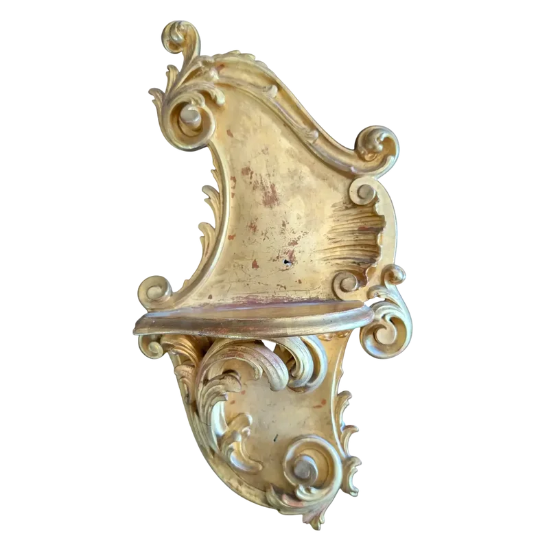 Carved and gilded wooden decorative shelf with rocaille scrolls