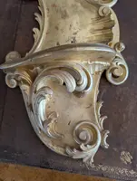 Carved and gilded wooden decorative shelf with rocaille scrolls