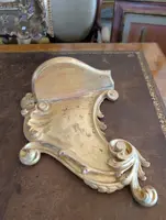 Carved and gilded wooden decorative shelf with rocaille scrolls