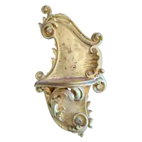 Carved and gilded wooden decorative shelf with rocaille scrolls