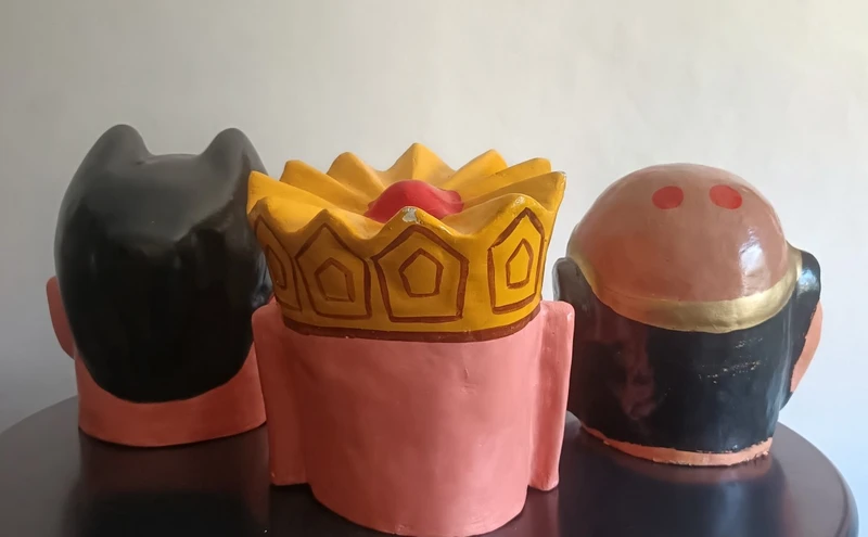 Triptych of Chinese masks from 1920 papier mache