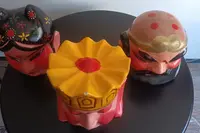 Triptych of Chinese masks from 1920 papier mache