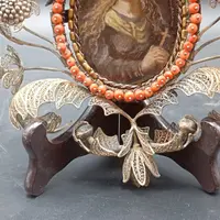 SILVER FILIGREE BEDSIDE TABLE WITH SMALL PAINTING DEPICTING SAINT ROSALIE