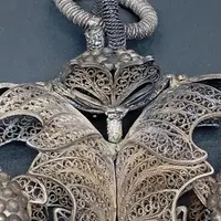 SILVER FILIGREE BEDSIDE TABLE WITH SMALL PAINTING DEPICTING SAINT ROSALIE