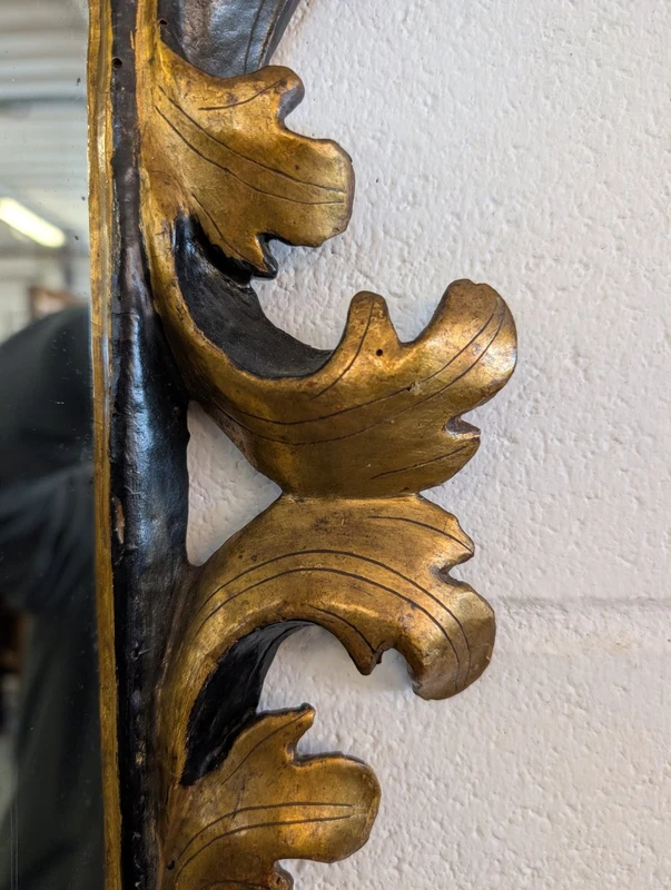Pair of Tuscan mirrors in gilt and ebonized wood, 18th century