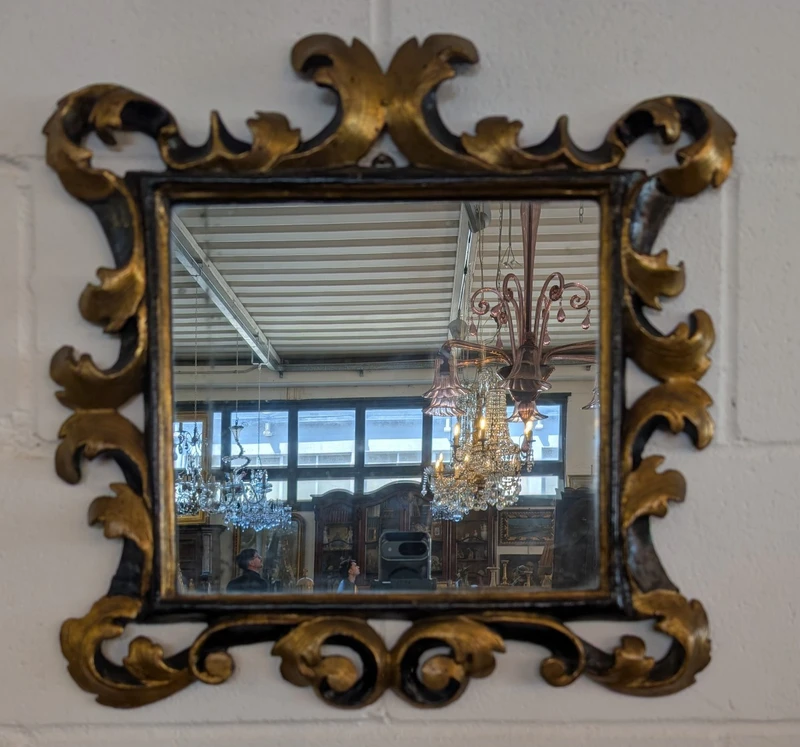 Pair of Tuscan mirrors in gilt and ebonized wood, 18th century