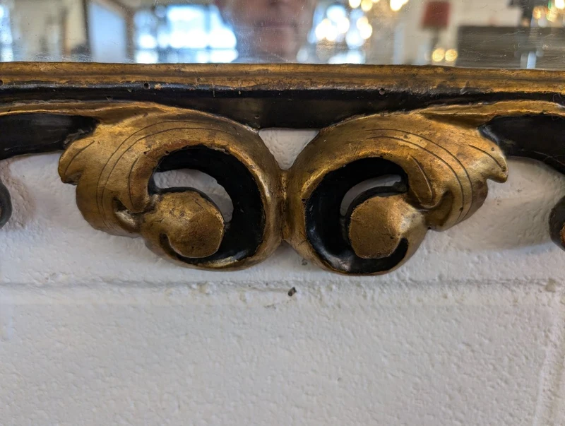 Pair of Tuscan mirrors in gilt and ebonized wood, 18th century