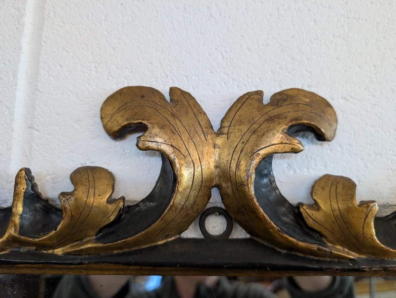 Pair of Tuscan mirrors in gilt and ebonized wood, 18th century