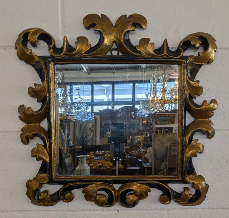 Pair of Tuscan mirrors in gilt and ebonized wood, 18th century