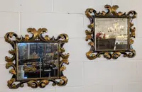 Pair of Tuscan mirrors in gilt and ebonized wood, 18th century