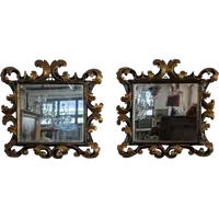 Pair of Tuscan mirrors in gilt and ebonized wood, 18th century