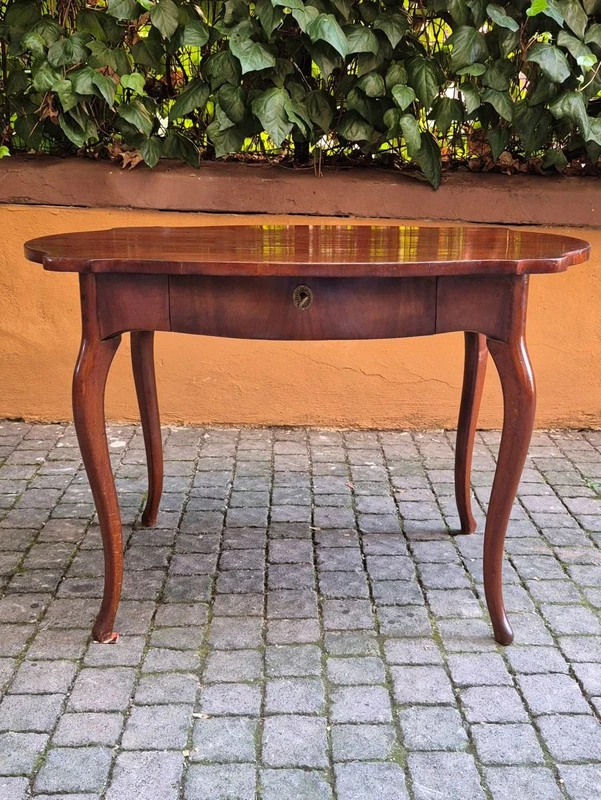 Moved antique walnut panelled writing table