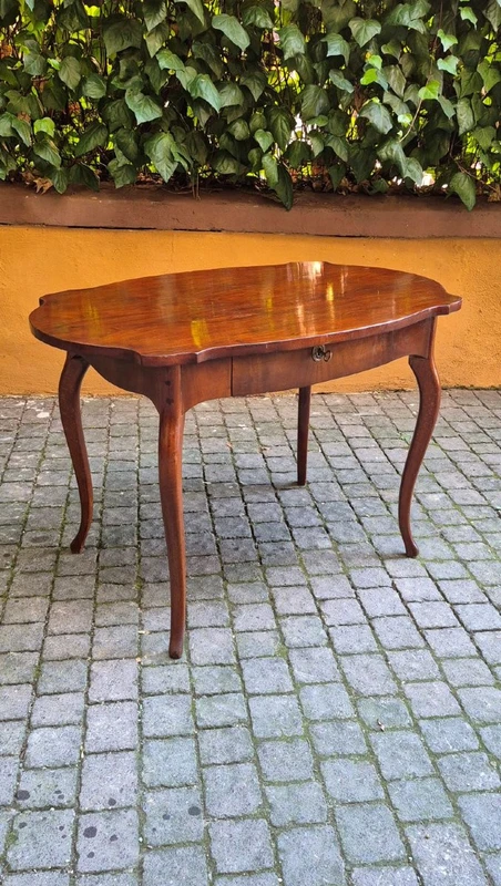 Moved antique walnut panelled writing table