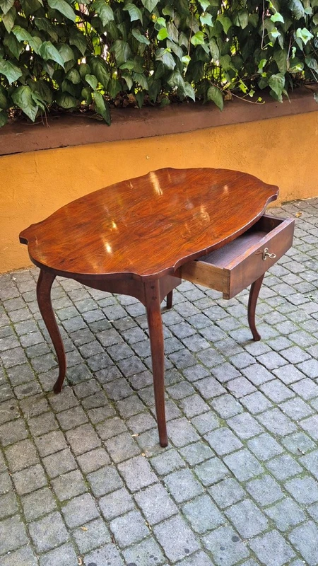 Moved antique walnut panelled writing table