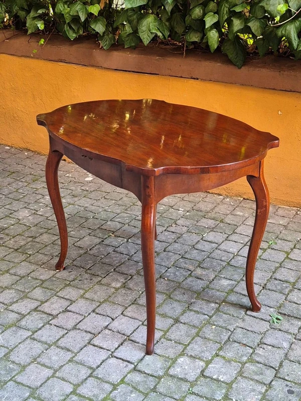 Moved antique walnut panelled writing table