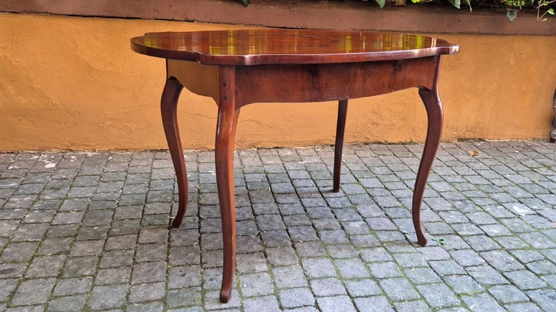 Moved antique walnut panelled writing table