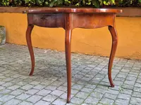 Moved antique walnut panelled writing table